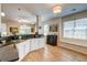 Spacious kitchen with granite countertops, white cabinets, and hardwood flooring at 1231 Wild Olive Dr, Mount Pleasant, SC 29464