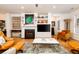 Spacious living room with a fireplace, built-in shelving, and comfortable leather seating at 1231 Wild Olive Dr, Mount Pleasant, SC 29464