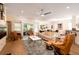 Bright living room featuring hardwood floors, modern ceiling fan, and access to the outdoor patio at 1231 Wild Olive Dr, Mount Pleasant, SC 29464