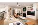 Inviting living room with a fireplace, built-in shelving, a modern ceiling fan, and an open floor plan at 1231 Wild Olive Dr, Mount Pleasant, SC 29464