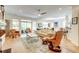 Open-concept living room with hardwood floors, comfortable seating, and a view of the dining area at 1231 Wild Olive Dr, Mount Pleasant, SC 29464
