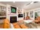 Cozy living room with a fireplace, modern decor, and comfortable leather seating at 1231 Wild Olive Dr, Mount Pleasant, SC 29464