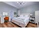 Bright main bedroom with wood floors, a vaulted ceiling, and stylish decor at 1231 Wild Olive Dr, Mount Pleasant, SC 29464