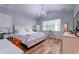 Serene main bedroom boasting vaulted ceiling, wood floors, and ample natural light at 1231 Wild Olive Dr, Mount Pleasant, SC 29464
