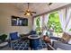 Covered patio with ceiling fan, curtains, fire pit, outdoor furniture, and a TV at 1231 Wild Olive Dr, Mount Pleasant, SC 29464
