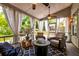 Covered patio with comfortable seating, a ceiling fan, and views of the backyard at 1231 Wild Olive Dr, Mount Pleasant, SC 29464