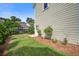 Landscaped backyard featuring green grass and a privacy fence for outdoor enjoyment at 1363 Rivella Dr, Mount Pleasant, SC 29464