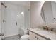 Bathroom featuring a glass enclosed shower, granite countertop, and oval mirror at 1363 Rivella Dr, Mount Pleasant, SC 29464