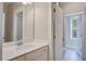 Well-lit bathroom featuring neutral walls, vanity, and access to a tub/shower combo at 1363 Rivella Dr, Mount Pleasant, SC 29464