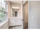 Charming bathroom showcasing a large window and a vanity with stylish fixtures and ample storage at 1363 Rivella Dr, Mount Pleasant, SC 29464