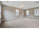 Spacious carpeted bedroom with ample natural light from the multiple windows at 1363 Rivella Dr, Mount Pleasant, SC 29464