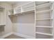 Ample storage space with built-in shelves and clothing rods in the walk-in closet at 1363 Rivella Dr, Mount Pleasant, SC 29464