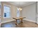 Dining room with wood table, chandelier, and natural light from the window at 1363 Rivella Dr, Mount Pleasant, SC 29464