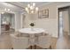Chic dining room with a marble table, stylish seating, and an elegant chandelier creating a sophisticated ambiance at 1363 Rivella Dr, Mount Pleasant, SC 29464