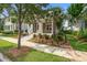 Charming home featuring a welcoming porch and colorful, well-maintained landscaping enhancing its curb appeal at 1363 Rivella Dr, Mount Pleasant, SC 29464
