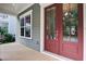 Elegant porch featuring a double door entry with glass panels and views of the outdoor landscape at 1363 Rivella Dr, Mount Pleasant, SC 29464