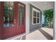 Welcoming porch with a bright red double door entrance and a view of the neighborhood landscape at 1363 Rivella Dr, Mount Pleasant, SC 29464