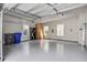 Clean, spacious two-car garage with epoxy floors, ample storage and natural light at 1363 Rivella Dr, Mount Pleasant, SC 29464