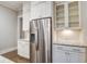 Kitchen view showcasing stainless steel appliances, white cabinets, granite countertops, and subway tile backsplash at 1363 Rivella Dr, Mount Pleasant, SC 29464