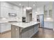 Spacious kitchen featuring an island with granite countertop, stainless appliances, and subway tile backsplash at 1363 Rivella Dr, Mount Pleasant, SC 29464