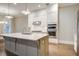 This bright kitchen showcases white cabinets, stainless steel appliances, and a large center island with a light countertop at 1363 Rivella Dr, Mount Pleasant, SC 29464