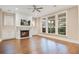 Inviting living room featuring a fireplace, built-in cabinets, and large windows at 1363 Rivella Dr, Mount Pleasant, SC 29464
