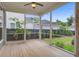 Relaxing screened porch featuring wood floors, ceiling fan, and beautiful backyard views at 1363 Rivella Dr, Mount Pleasant, SC 29464