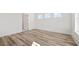 Bright bedroom with wood-look flooring, white walls, and double hung windows at 137 Summerwind Dr, Summerville, SC 29486