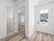Bright foyer featuring luxury vinyl plank flooring and a view to the front yard at 137 Summerwind Dr, Summerville, SC 29486