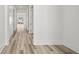 Hallway with wood floors and white trim at 137 Summerwind Dr, Summerville, SC 29486