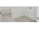 Walk-in pantry with white shelving and gray tile flooring at 137 Summerwind Dr, Summerville, SC 29486