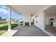 Covered patio featuring a fireplace and a view of the backyard and kitchen at 137 Summerwind Dr, Summerville, SC 29486