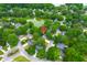 Expansive aerial view of the property highlighting its location near a pond and lush greenery at 1394 Center Lake Dr, Mount Pleasant, SC 29464