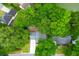 Overhead aerial view of the home surrounded by lush trees and greenery in a quiet neighborhood at 1394 Center Lake Dr, Mount Pleasant, SC 29464