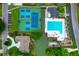 Aerial view of community amenities with swimming pool, tennis courts, and parking, set amongst lush greenery at 1394 Center Lake Dr, Mount Pleasant, SC 29464