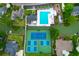Aerial view of community pool and tennis courts amid lush landscaping, offering a vibrant recreational space at 1394 Center Lake Dr, Mount Pleasant, SC 29464
