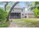 Spacious backyard with a covered porch and a large tree, perfect for outdoor entertaining at 1394 Center Lake Dr, Mount Pleasant, SC 29464