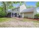 Large backyard featuring a screened porch, patio, and a well-maintained lawn, great for outdoor activities at 1394 Center Lake Dr, Mount Pleasant, SC 29464