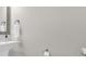Well-lit half bathroom featuring a pedestal sink, mirror, and towel ring at 1394 Center Lake Dr, Mount Pleasant, SC 29464