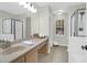 Bright bathroom featuring a vanity, large mirror, and a glass-enclosed shower showcasing a clean design at 1394 Center Lake Dr, Mount Pleasant, SC 29464