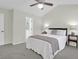 Bedroom with a plush bed, ceiling fan, and bedside tables, showcasing a relaxing and inviting atmosphere at 1394 Center Lake Dr, Mount Pleasant, SC 29464