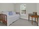 Guest bedroom with a trundle daybed, wood floors, and bright window at 1394 Center Lake Dr, Mount Pleasant, SC 29464