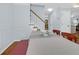 Open concept dining area featuring staircase with a white railing and wood steps at 1394 Center Lake Dr, Mount Pleasant, SC 29464