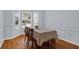 Bright dining area featuring bay windows allowing natural light and wood flooring at 1394 Center Lake Dr, Mount Pleasant, SC 29464
