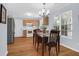 Inviting dining area featuring a wooden table, chandelier, and view into kitchen at 1394 Center Lake Dr, Mount Pleasant, SC 29464