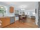 Charming dining room with hardwood floors, chandelier, and connection to kitchen at 1394 Center Lake Dr, Mount Pleasant, SC 29464