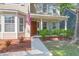 Home's charming entrance featuring an American flag and manicured landscaping at 1394 Center Lake Dr, Mount Pleasant, SC 29464