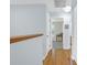 Hallway upstairs featuring hardwood floors and views of a bedroom at 1394 Center Lake Dr, Mount Pleasant, SC 29464