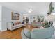 Bright living room with hardwood floors, comfortable seating, and a view to the dining area at 1394 Center Lake Dr, Mount Pleasant, SC 29464