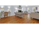 Well-lit living room with hardwood floors, fireplace, and comfortable seating area at 1394 Center Lake Dr, Mount Pleasant, SC 29464